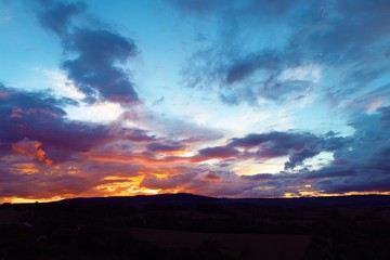 Sunset aerial view on countryside. Great landscape. Colored sky.