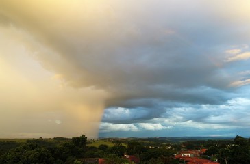 Storm aerial view on countryside. Rain, clouds, dramatic scene.