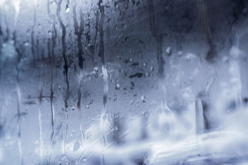 Naklejka na ściany i meble Glass with water drops as background