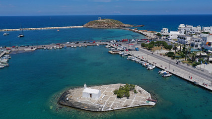Fototapeta premium Aerial drone photo of iconic port of Naxos island featuring uphill castle and beautiful Temple of Apollon or Gate, Cyclades, Greece