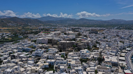 Aerial drone photo of iconic port of Naxos island featuring uphill castle and beautiful Temple of...