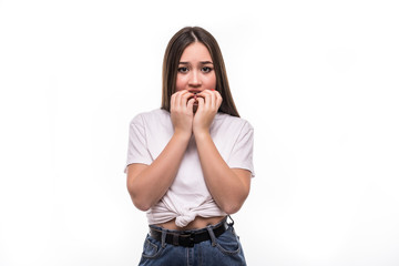 Shocked and surprised beautiful mixed race asian woman with scare emotions isolated on white...