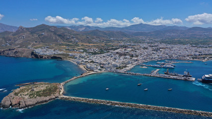Aerial drone photo of iconic port of Naxos island featuring uphill castle and beautiful Temple of...