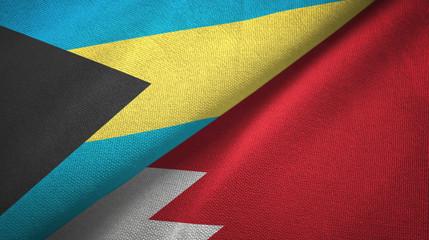 Obraz premium Bahamas and Bahrain two flags textile cloth, fabric texture 