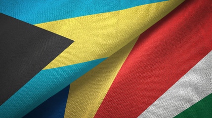 Obraz premium Bahamas and Seychelles two flags textile cloth, fabric texture