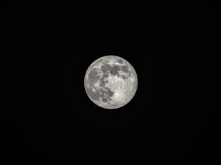Full moon on the dark night sky