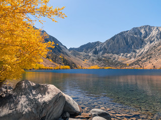 Mountain lake scenery with stunning autumn colors and blue water