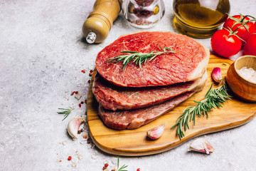 Fresh raw Black Angus beef steak on wooden board
