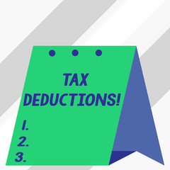 Writing note showing Tax Deductions. Business concept for reduction income that is able to be taxed of expenses
