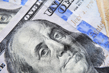 Dolar USA close up. Franklin eyes macro. The texture of the fragment of the dollar bill. USD banknote texture. One hundred American dollars. $ 100.