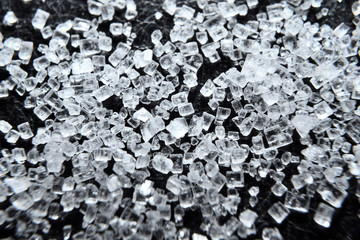 Sugar macro. Sugar crystals close up on a black background.