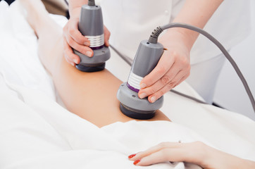 Body care. Ultrasound cavitation body contouring treatment. Radiofrequency therapy. Active thermolysis. lifting. Body massage with bipolar radio frequencies - obrazy, fototapety, plakaty