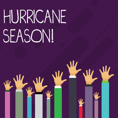 Word writing text Hurricane Season. Business photo showcasing time when most tropical cyclones are expected to develop Hands of Several Businessmen Raising Up Above the Head, Palm Facing Front