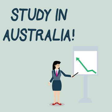 Conceptual hand writing showing Study In Australia. Concept meaning going into foreign country order complete your studies Woman Holding Stick Pointing to Chart of Arrow on Whiteboard
