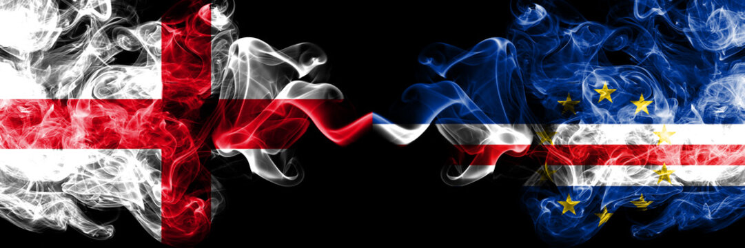 English vs Cape Verde smoky mystic flags placed side by side. Thick colored silky smokes flag of England and Cape Verde.