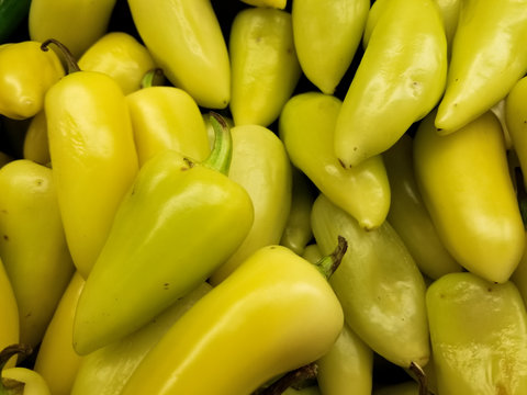 Hot yellow Caribe chili peppers in a supermarket shelf. Also named chile guero in Mexico. Typical food ingredient in Mexican-American cuisine.