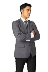 Happy young businessman in suit looking right on white background, isolated concept