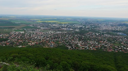 View of center of Nitra city, western Slovakia, from Zobor hill located above the city, cloudy spring day