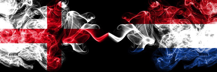 Fototapeta premium English vs Netherlands, Dutch smoky mystic flags placed side by side. Thick colored silky smokes flag of England and Netherlands, Dutch.