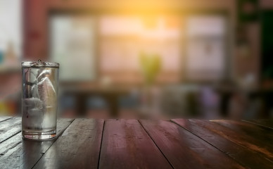 Perspective empty top of wood table on interior of cafe blurred background.  Space for your text and montage product display. 