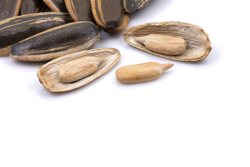 Sunflower seeds isolated on white background. Selective focus.