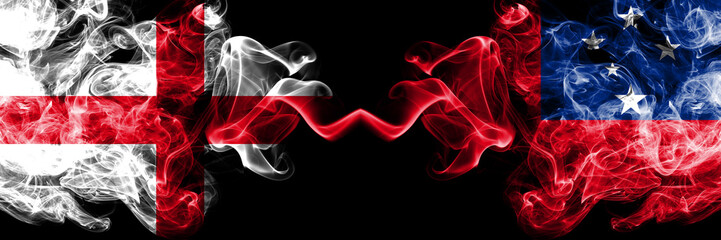 English vs Samoa, Samoan smoky mystic flags placed side by side. Thick colored silky smokes flag of England and Samoa, Samoan.