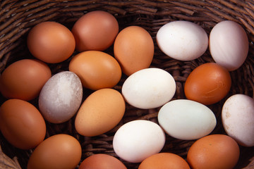 Chicken eggs and duck eggs placed in a basket