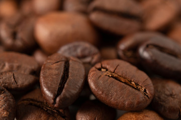 Roasted coffee beans close-up. Background with coffee beans. Macro.