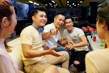 Cheerful friends in bolwing club