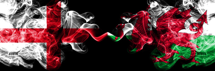 English vs Wales, Welsh smoky mystic flags placed side by side. Thick colored silky smokes flag of...