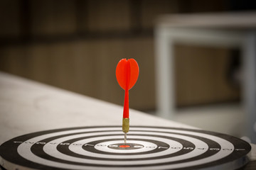 Red dart target arrow hitting on bullseye with,Target marketing and business success concept - Image