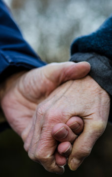 Old Couple Holding Hands Closely, Close Up