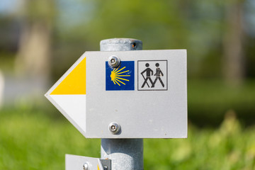 Sign showing the way to Santiago de Compostela. The Camino de Santiago is a network of pilgrims'...