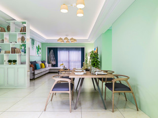 In the dining room area of the living room, the tableware has been placed