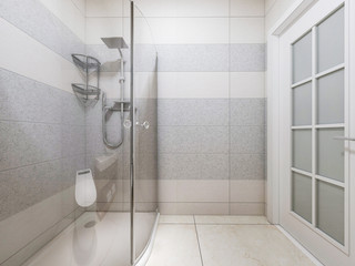 Modern bathroom in the home with smart toilet and shower, as well as sink and mirror