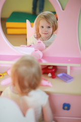 A small child is playing with toy