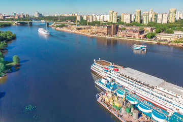 Scenic view of the city by the river with ships sailing on it. Concept clean city, life in the city. aerial shot, top shot