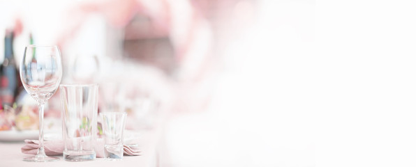Glasses on the table in the restaurant. Table setting.