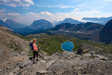 Middle age woman hiking in Canadian Rockies. Active vacation in Banff National Park. Alberta....