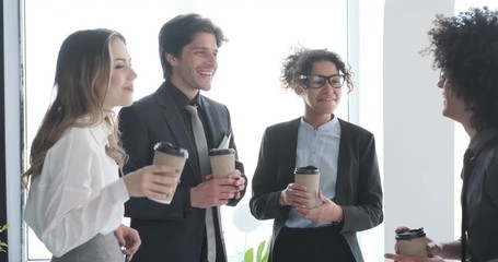 Business team interacting while having coffee break in office - Powered by Adobe