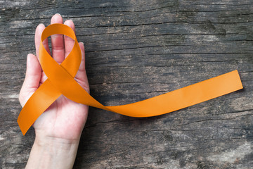 Amber color ribbon for raising awareness campaign on appendix cancer illness - obrazy, fototapety, plakaty