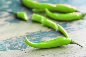 Hot green pepper. Chilean pepper on a black.