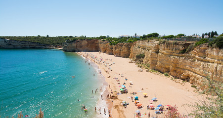 Chapel of Nossa Senhora da Rocha, Algarve, Portugal. Beach and bathers