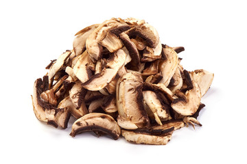 Sliced dried champignon mushrooms, close-up, isolated on white background