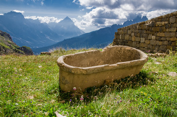 Dolomites in sunny weather with puffy clouds