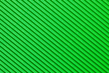 Abstract textured background created with striped details of green corrugated cardboard