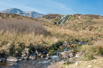 Fototapeta na wymiar Waterfall near the The Storr Old Man of Storr Landscape Panorama Highlands Isle of Skye Scotland