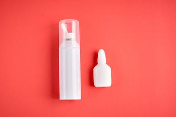 Nasal spray bottle composition, white template bottle on pink background