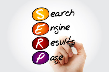 Hand writing SERP - Search Engine Results Page acronym with marker, concept background