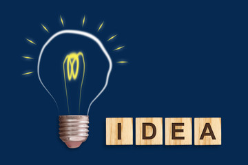 Concept Idea. Light bulb on a blue background. The concept of bright ideas for business, frequently...